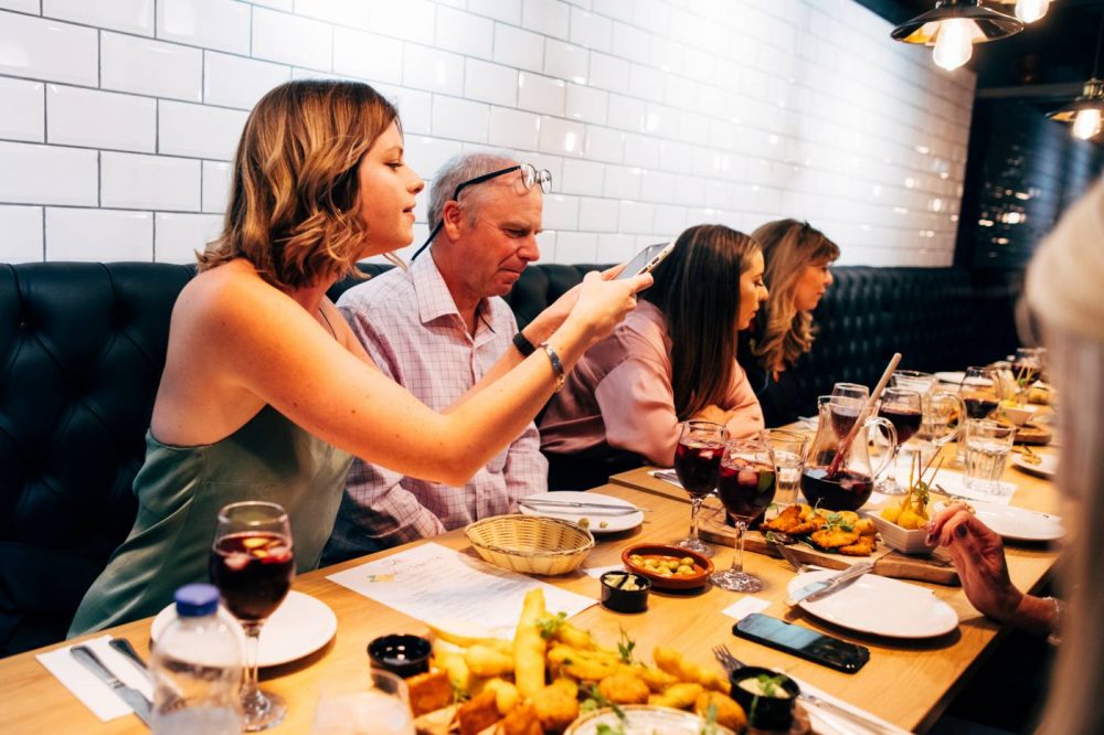 Sophie taking a photo of the sharing platter at Olé Tapas Bar