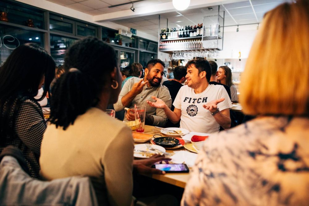 A photo of people talking at Olé Tapas Bar
