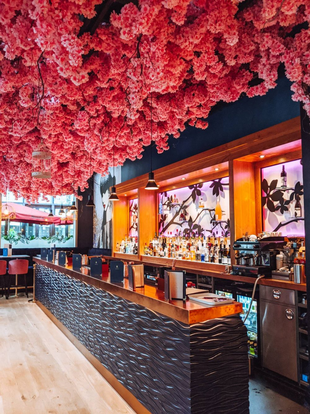 Blossom Room's bar with cherry blossom ceiling.