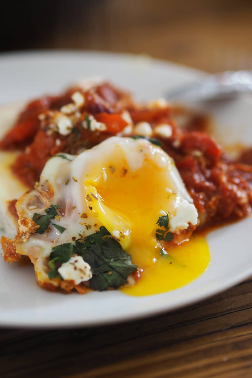 A runny egg yolk on a plate